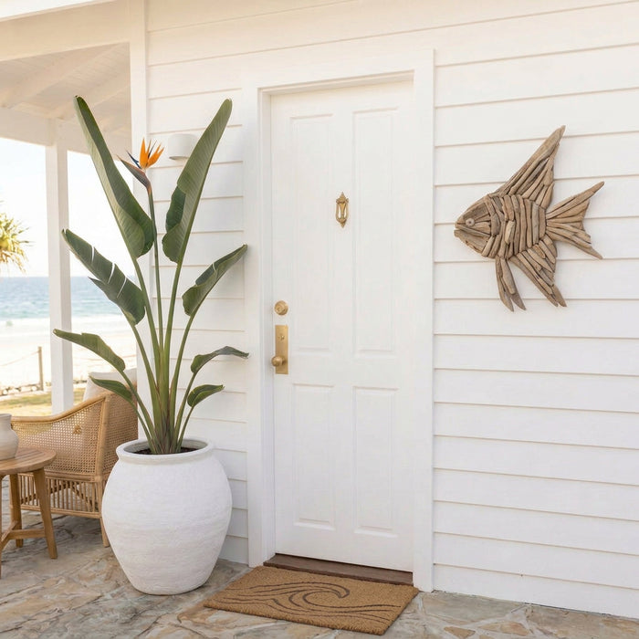 Add coastal charm to your home with Oceana, a handcrafted driftwood angelfish wall hanging. Unique natural wood décor for beach houses and Hamptons interiors.