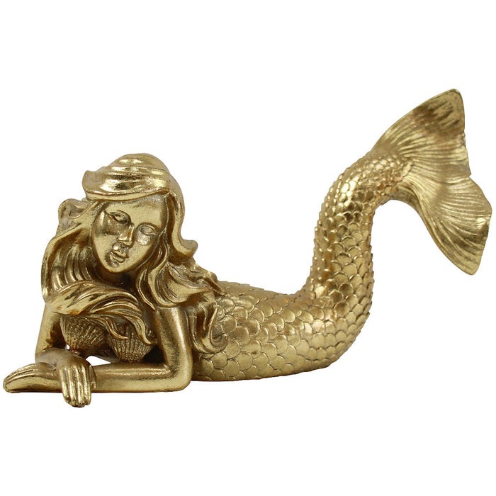 Add coastal elegance to your home with the Aurelia Gold Mermaid Sculpture. Crafted from intricately detailed resin, this 25cm mermaid ornament is perfect for styling shelves, consoles, and coffee tables.
