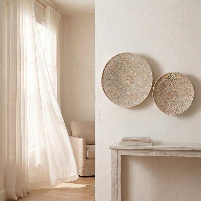 Handwoven binga wall baskets in a coastal boho neutral home