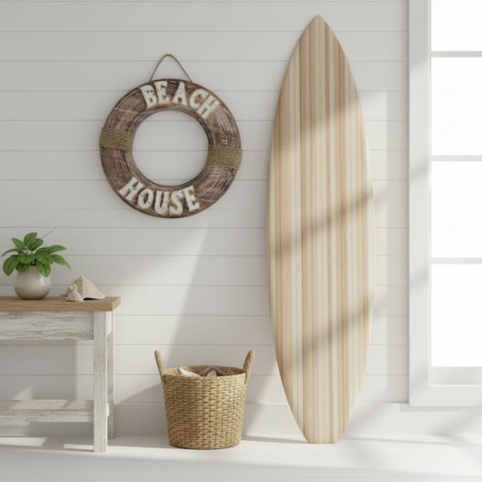 Decorative wooden life buoy with natural surfboard in a beach house 