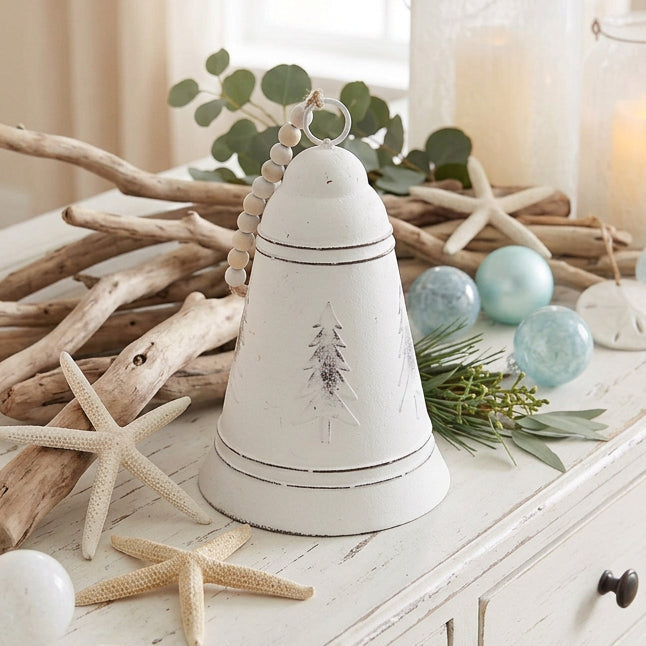 Shop our rustic white metal Christmas bell featuring a distressed vintage finish and chunky wooden beads. Perfect for farmhouse Christmas decorating.