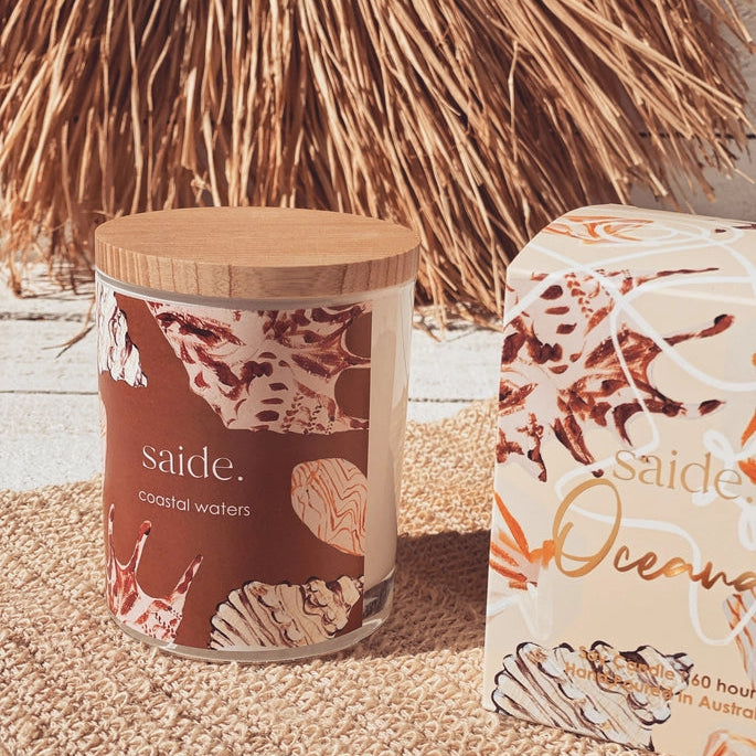 Oceana by Saide vegan soy candle with gold foil packaging designed by Caitlin Hope styled in a modern coastal home setting