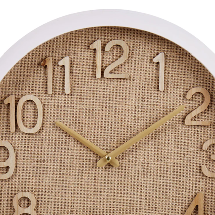 Discover the Oakley Linen Wall Clock featuring a woven natural linen dial, wooden numbers, and white glass frame. A stylish 40 cm decorative clock perfect for coastal, Hamptons, and modern interiors.