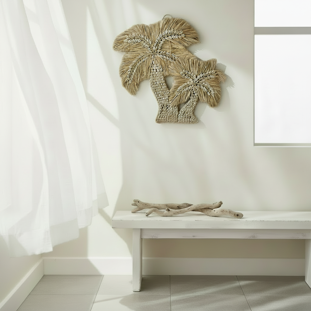 Handcrafted in Bali, the Isla Palm Seagrass Wall Hanging features natural seagrass and cowrie shell detailing for relaxed coastal styling.