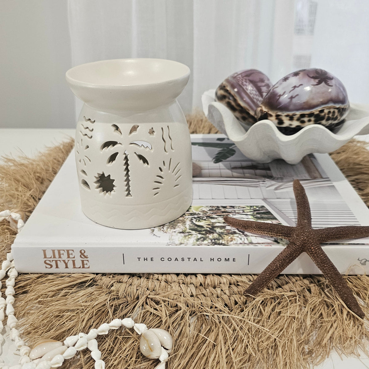 Lumi Coast Ceramic Oil Burner with intricate cut-out design for coastal home decor