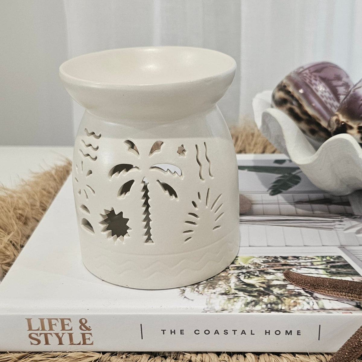 Lumi Coast Ceramic Oil Burner with intricate cut-out design for coastal home decor