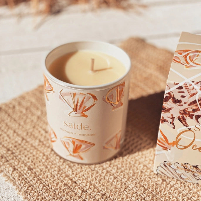 Oceana by Saide vegan soy candle with gold foil packaging designed by Caitlin Hope styled in a modern coastal home setting