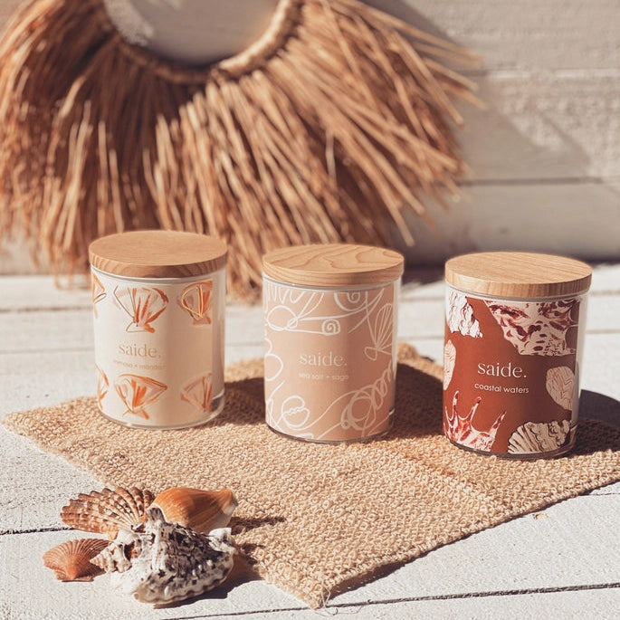 Oceana by Saide vegan soy candle with gold foil packaging designed by Caitlin Hope styled in a modern coastal home setting