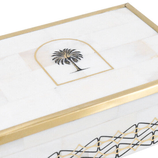 Decorative box with gold trim and palm tree design on a white background