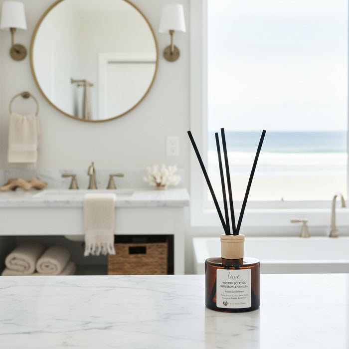 Reed diffuser with black sticks on a white background
