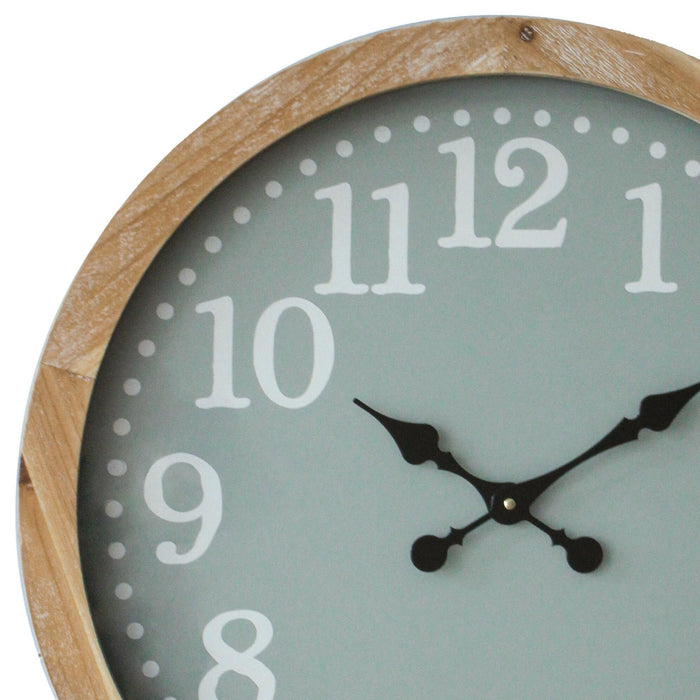 Round wall clock with wooden frame and light green face on a white background