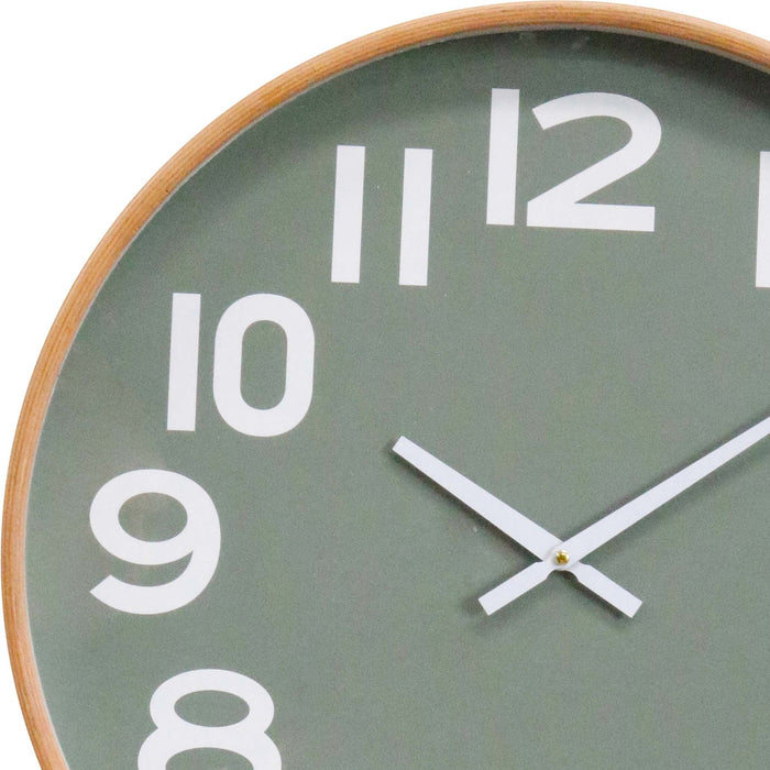 Green wall clock with white numbers and a wooden frame on a white background