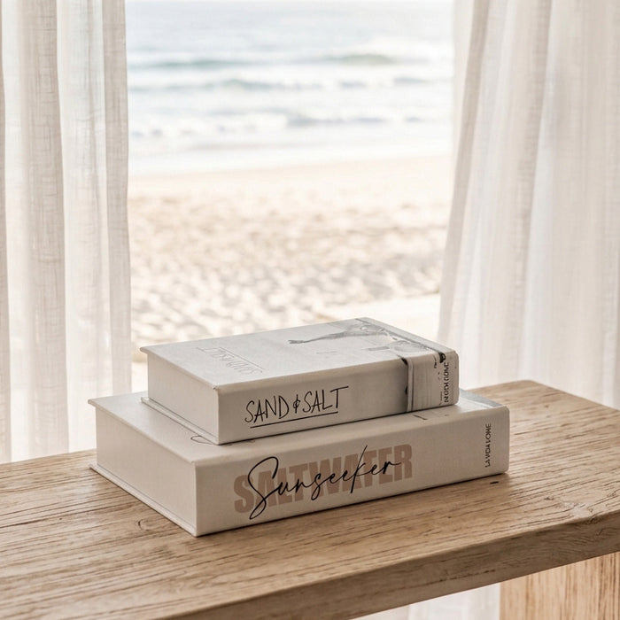 Add beach shack charm to your home with monochromatic surfer book boxes. Featuring vintage surf photography and hidden storage, perfect for coastal styling or gifting.