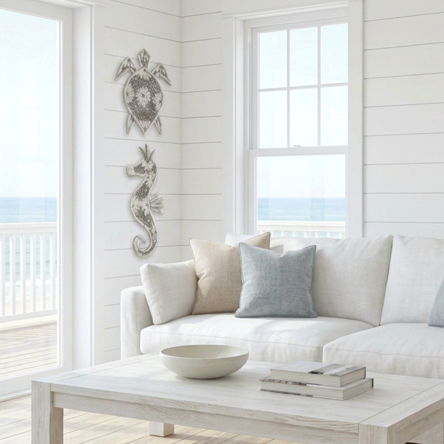 Handcrafted in Indonesia, this driftwood and shell seahorse wall hanging adds natural coastal charm to your beach house or seaside-inspired home.