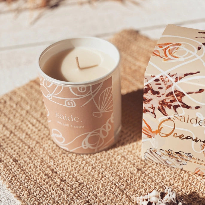 Oceana by Saide vegan soy candle with gold foil packaging designed by Caitlin Hope styled in a modern coastal home setting