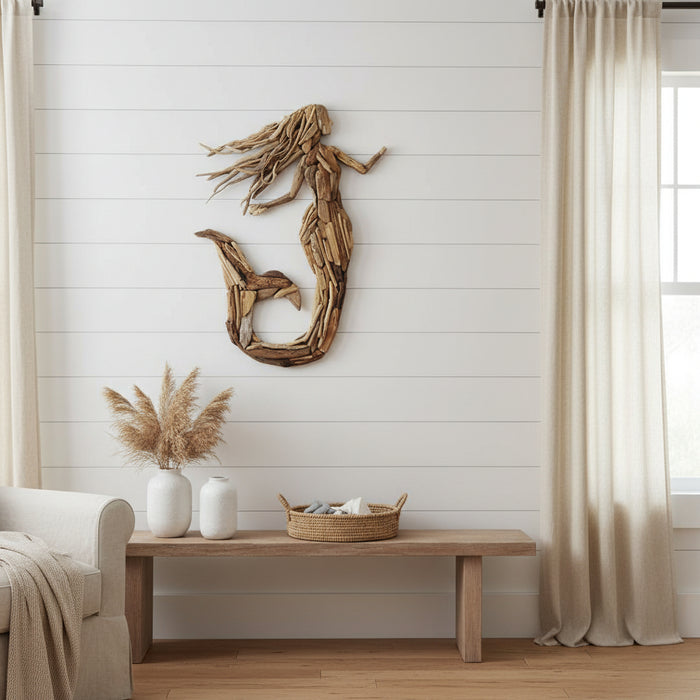 Create a stunning coastal statement with the Seraphina Driftwood Mermaid Wall Art. Handcrafted from natural driftwood, this 80cm wall décor adds timeless beach house charm and artisan style to any home.