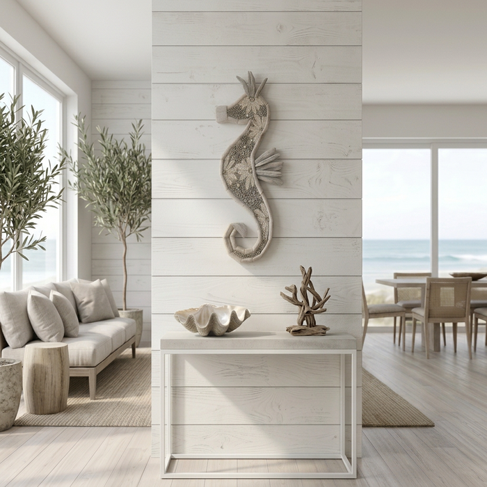 Handcrafted in Indonesia, this driftwood and shell seahorse wall hanging adds natural coastal charm to your beach house or seaside-inspired home.