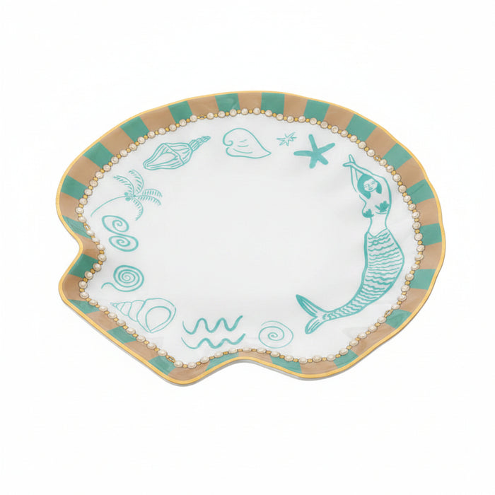 Shell-shaped trinket tray catch all plate with ocean-themed decorations on a white background