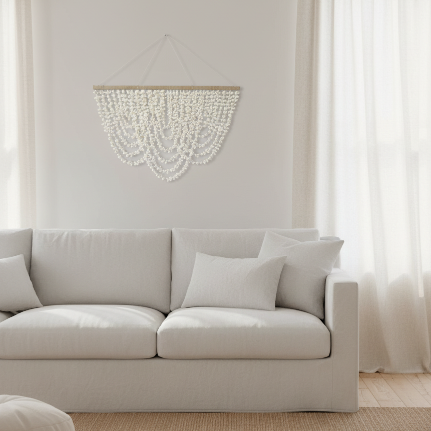 Handmade Balinese shell waterfall wall hanging with natural shells, woven jute hanger, and floating curtain design.