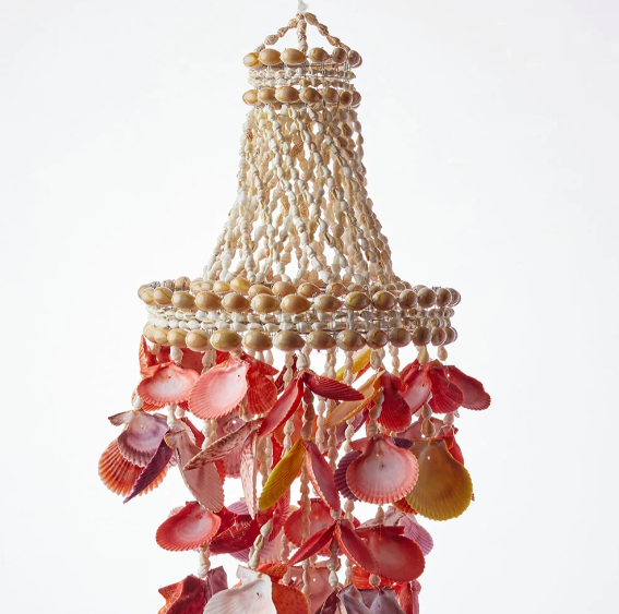 Handcrafted 75cm Sunset Shell Windchime Chandelier made from natural sunset-coloured shells. A warm, textured coastal statement piece for your home.