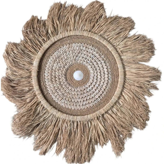 Shop the Tulum Cowrie Shell Wall Hanging, crafted from natural raffia and cowrie shells. A statement piece for tropical, coastal and boho interiors.