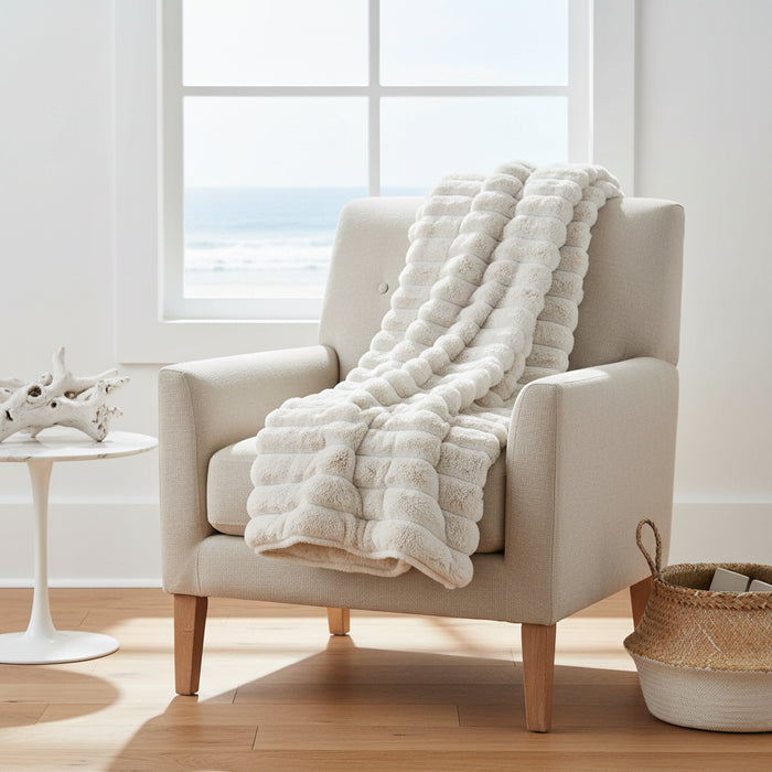 Off white faux fur puffer throw 130 x 150 cm with horizontal puff texture and smooth backing coastal home decor